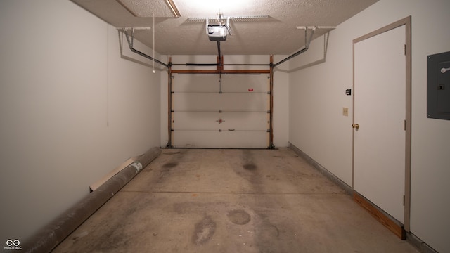 garage featuring a garage door opener and electric panel