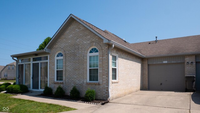 view of side of property featuring a garage