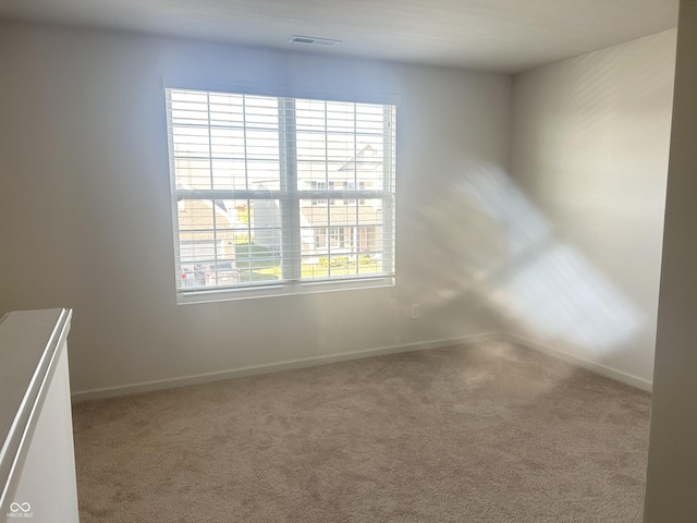 spare room with carpet flooring