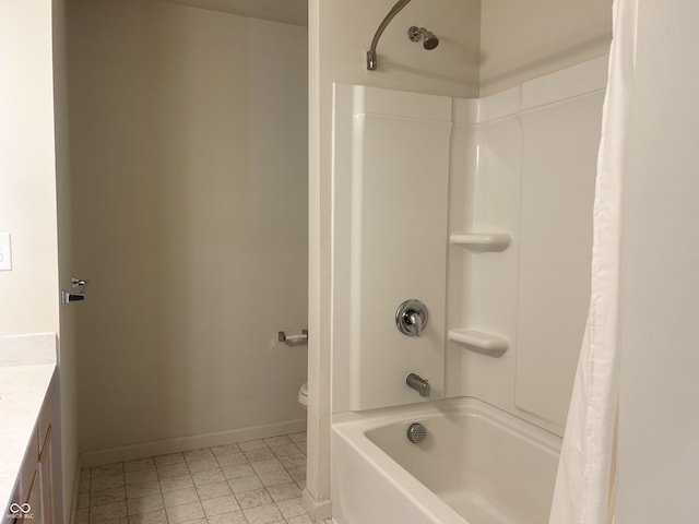 full bathroom featuring vanity, shower / bath combo, and toilet