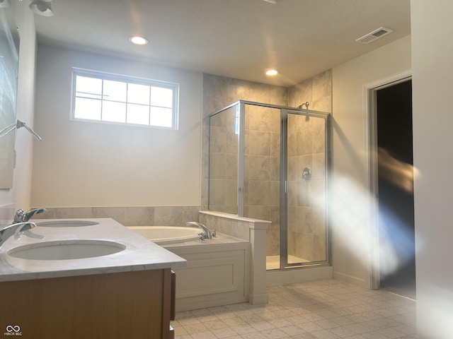 bathroom with independent shower and bath and sink