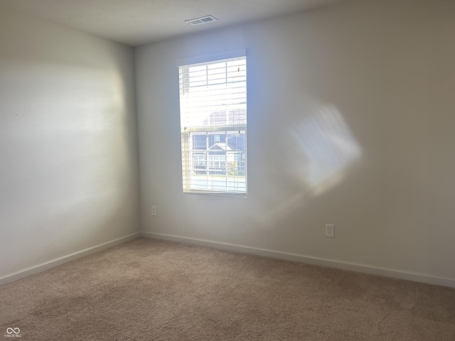 empty room featuring carpet floors