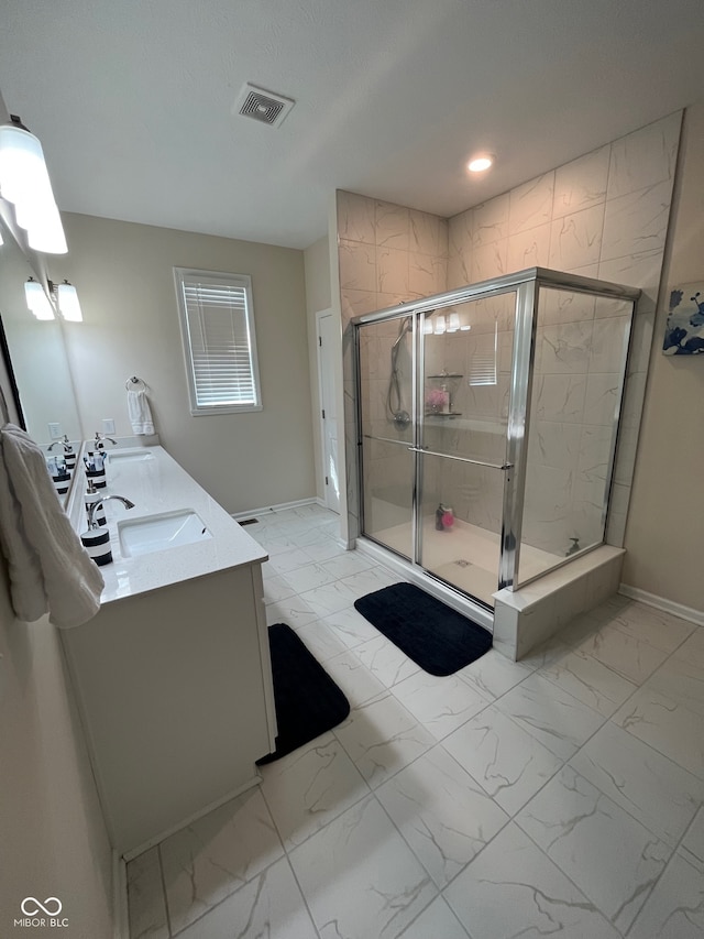 bathroom with vanity and walk in shower