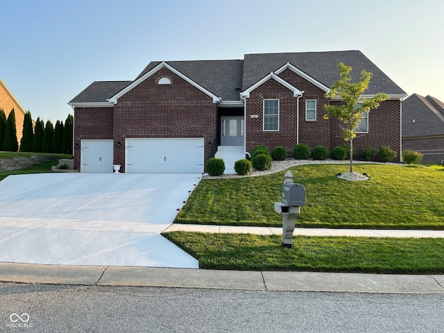 view of front facade featuring a garage and a front lawn