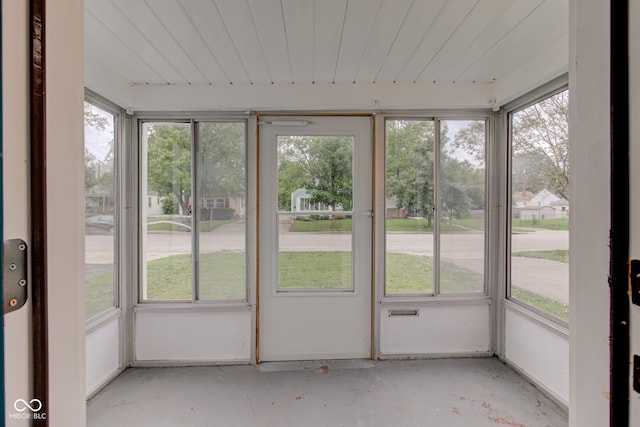 unfurnished sunroom with a wealth of natural light