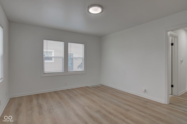 unfurnished room with light hardwood / wood-style flooring