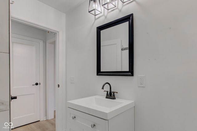 bathroom with vanity and hardwood / wood-style flooring