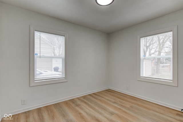 empty room with light hardwood / wood-style floors