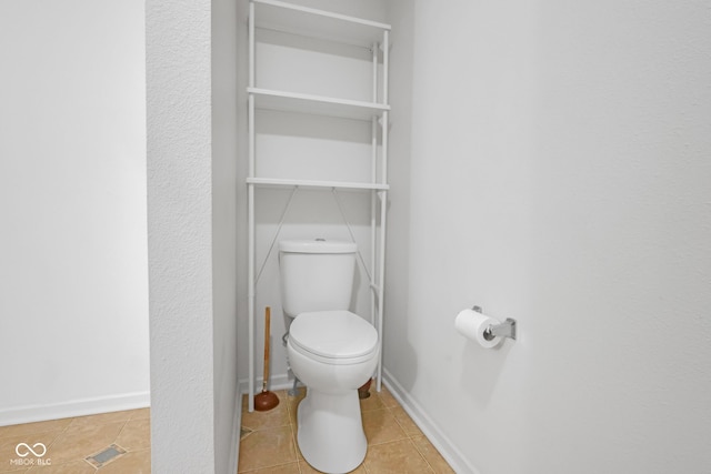 bathroom featuring tile patterned floors and toilet