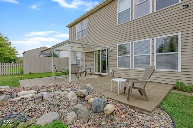 back of house with a gazebo and a patio area