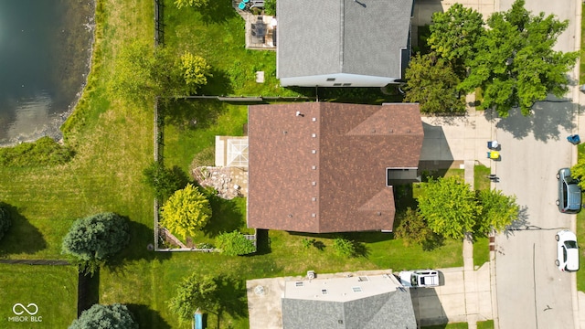 birds eye view of property featuring a water view