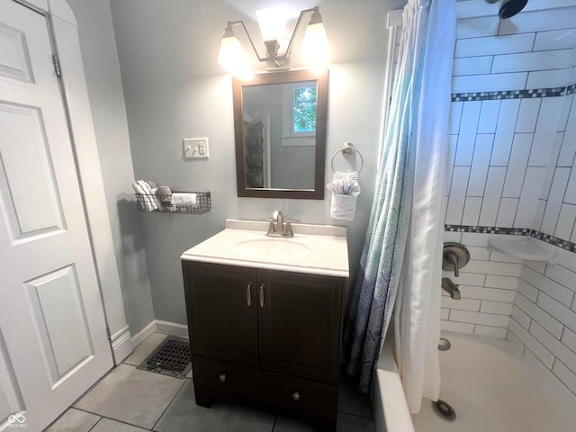 bathroom with vanity, shower / tub combo with curtain, and tile patterned floors