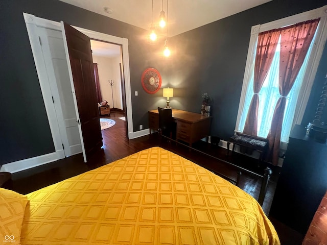 bedroom featuring dark wood-type flooring