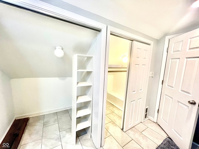 interior space featuring vaulted ceiling