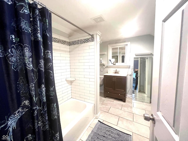 bathroom with vanity, tile patterned floors, and shower / bath combo with shower curtain