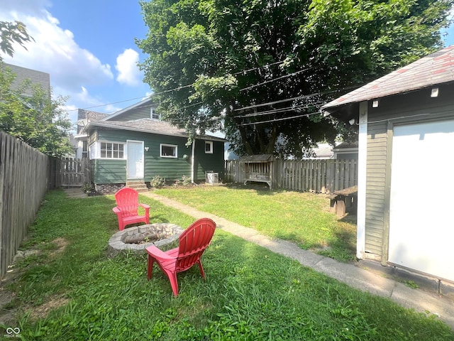 view of yard with a fire pit