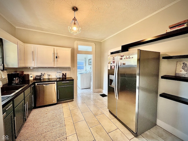 kitchen featuring a textured ceiling, pendant lighting, appliances with stainless steel finishes, and white cabinetry