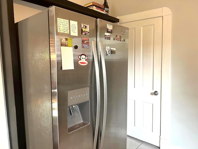 kitchen with stainless steel fridge and light tile patterned flooring