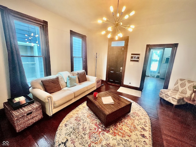 living room with wood-type flooring and a chandelier