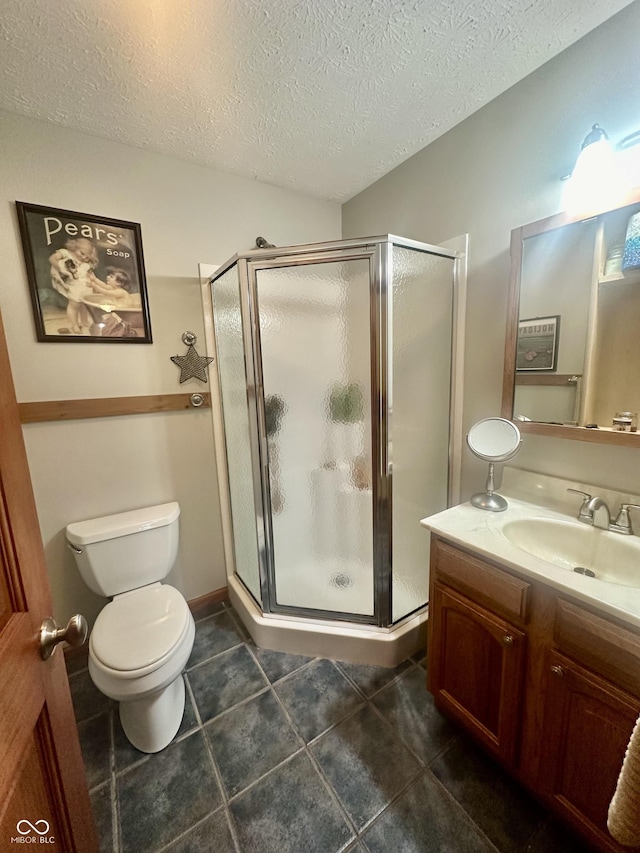 full bath with toilet, a stall shower, tile patterned flooring, and vanity