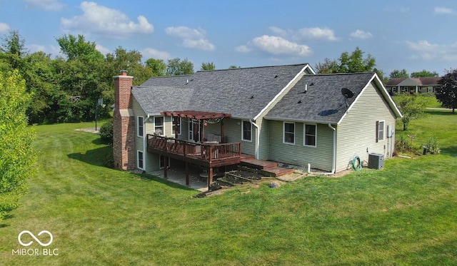 back of property featuring a deck, central air condition unit, a lawn, a pergola, and a chimney