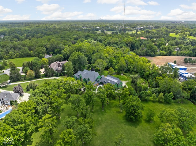 birds eye view of property featuring a view of trees