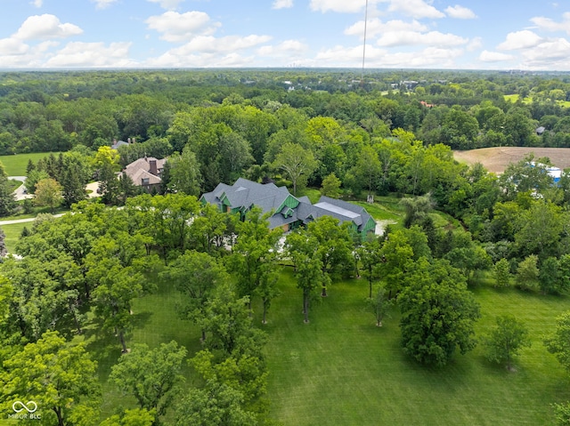 bird's eye view featuring a wooded view