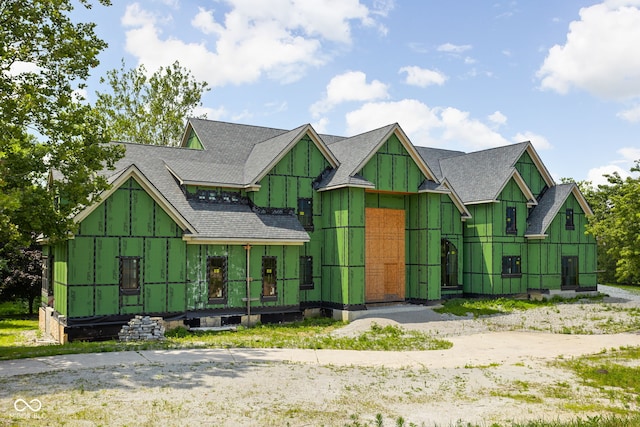 view of front facade featuring roof with shingles