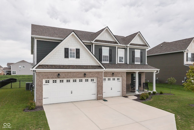 view of front of property with central AC unit, a porch, a garage, and a front yard