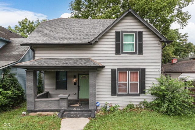 view of front of property with a front lawn