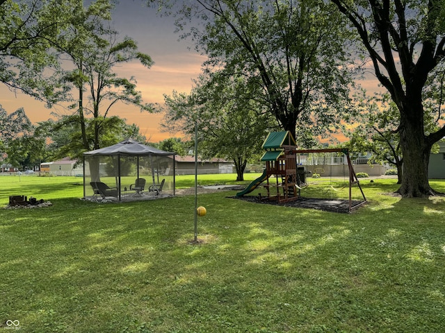5647 W Mooresville Rd, Indianapolis, IN 46221 - yard at dusk featuring a playground