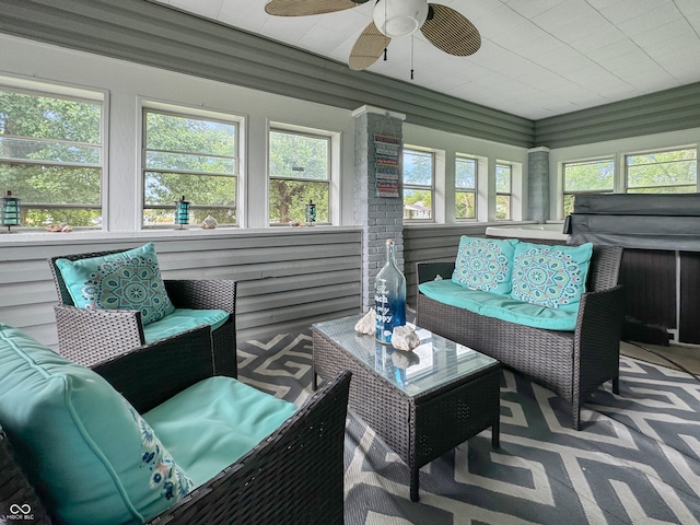 sunroom featuring ceiling fan