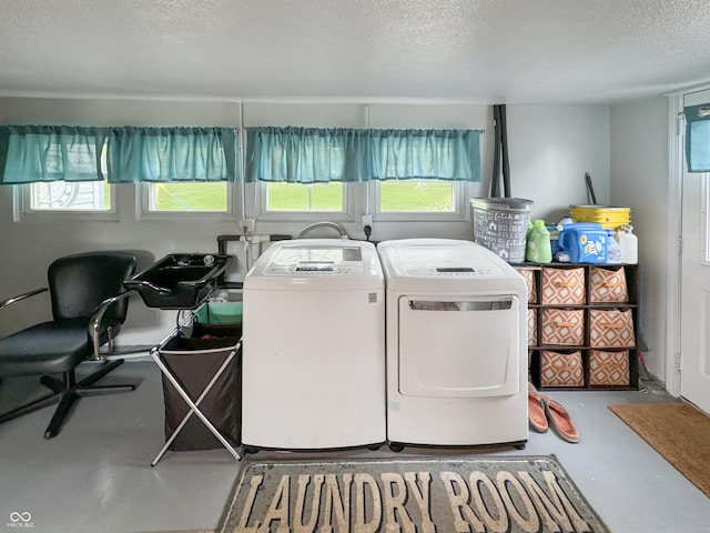 5647 W Mooresville Rd, Indianapolis, IN 46221 - washroom with a textured ceiling and washing machine and clothes dryer