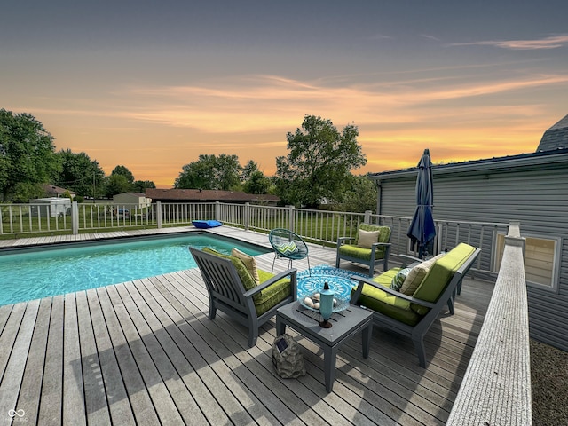 5647 W Mooresville Rd, Indianapolis, IN 46221 - pool at dusk featuring outdoor lounge area and a deck