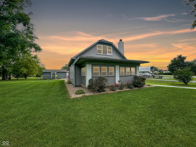 bungalow-style home featuring a yard