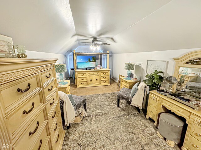 bedroom featuring multiple windows, ceiling fan, and vaulted ceiling