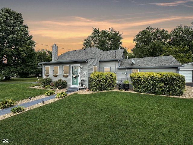 5647 W Mooresville Rd, Indianapolis, IN 46221 - view of front of house featuring a yard and a garage