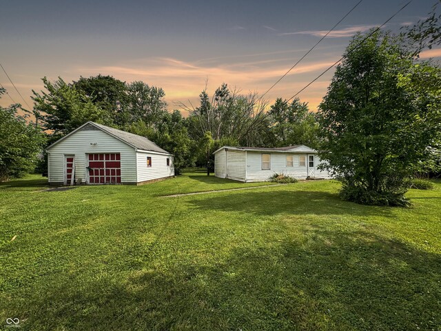 yard at dusk with an outbuilding