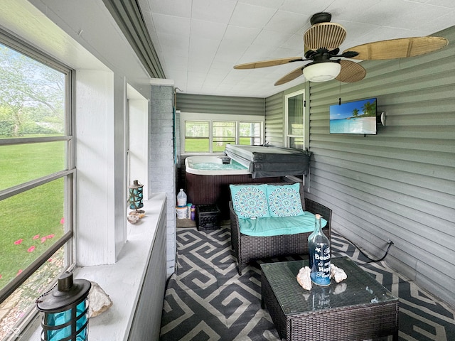 sunroom / solarium with ceiling fan