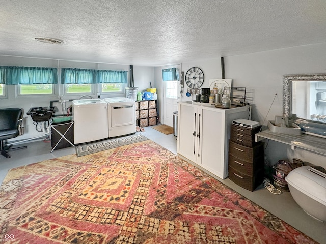 5647 W Mooresville Rd, Indianapolis, IN 46221 - living room featuring separate washer and dryer and a textured ceiling