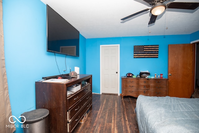 bedroom with ceiling fan and dark hardwood / wood-style floors