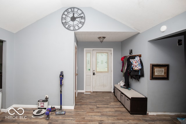 entrance foyer featuring hardwood / wood-style flooring and lofted ceiling