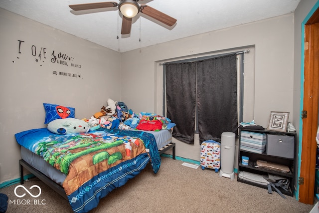 carpeted bedroom featuring ceiling fan