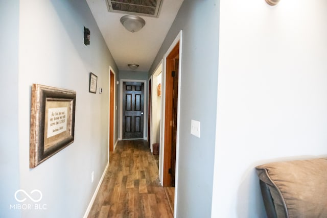 hallway featuring dark wood-type flooring