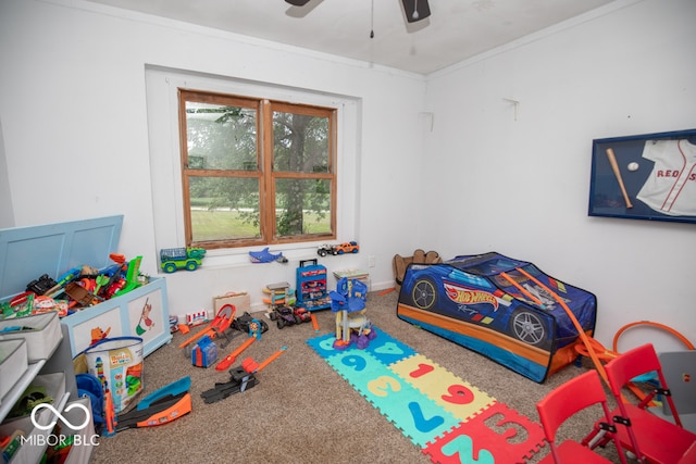 interior space with ceiling fan and ornamental molding