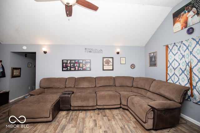 living room with wood-type flooring, vaulted ceiling, and ceiling fan