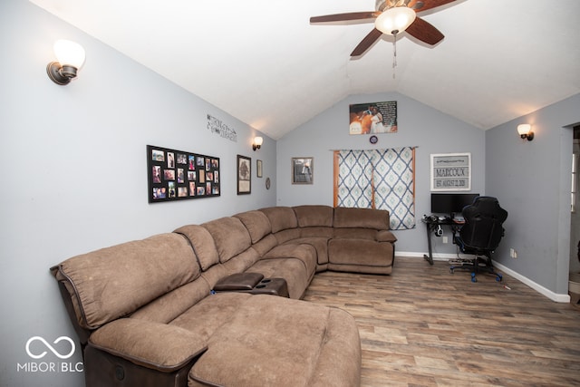 living room with lofted ceiling, hardwood / wood-style flooring, and ceiling fan