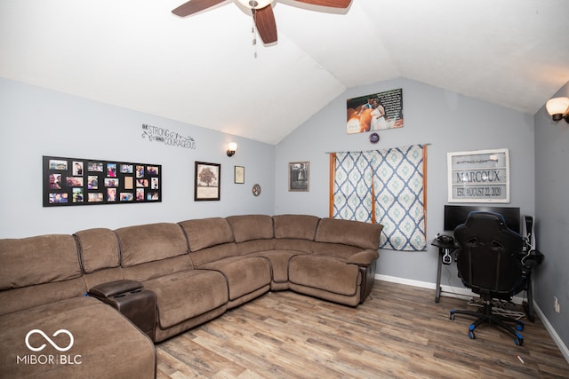 living room with vaulted ceiling, hardwood / wood-style floors, and ceiling fan