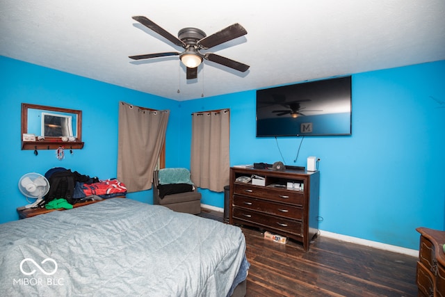 bedroom with wood-type flooring and ceiling fan