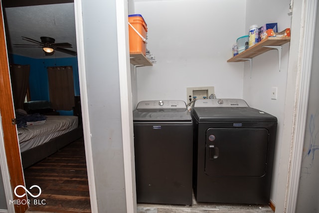 laundry area featuring dark hardwood / wood-style floors, ceiling fan, and washer and dryer